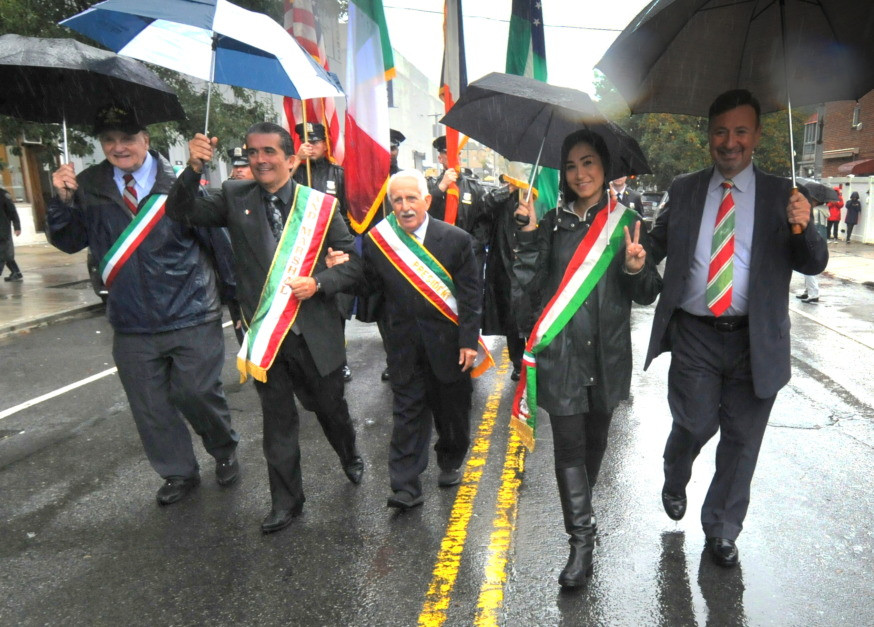 Thomas Principe Esq., a former parade Grand Marshal (center) with Grand Marshal Clemente Lopes (center left) (Photo by Walter Karling)