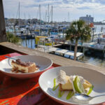 Key Lime Pie from Shaggy's Fun restaurant in Pensacola, Florida, enticing viewers with its vibrant colors and delicious presentation, showcasing a moment of culinary delight and hinting at a relaxed, coastal lifestyle