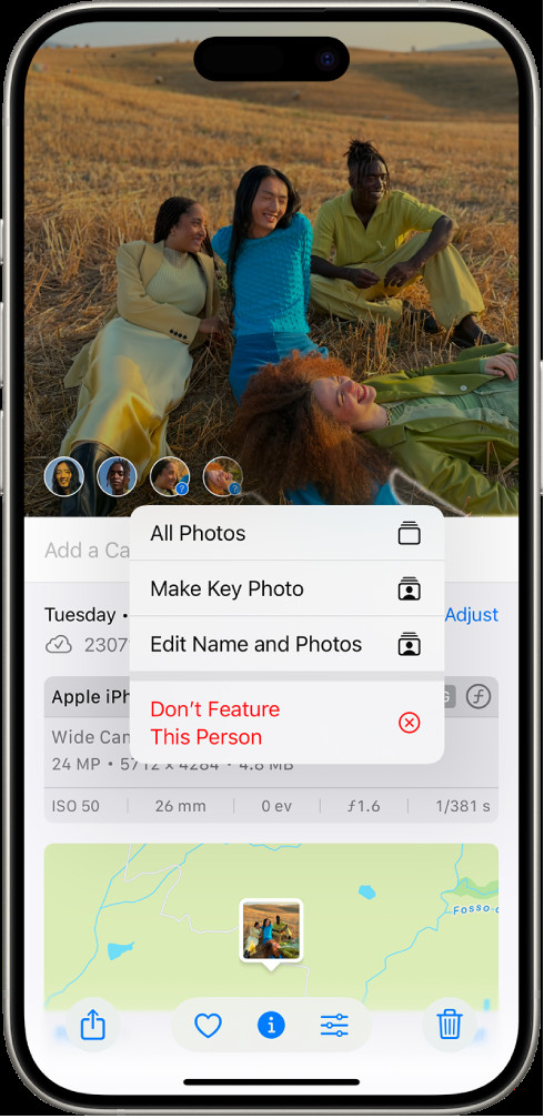 Tagging a person from a photo in Apple Photos on iPhone showing options like Name This Person
