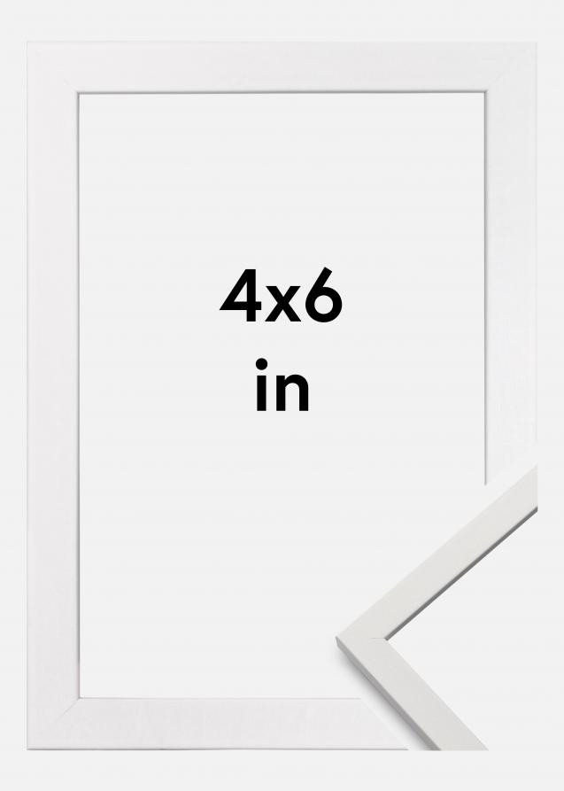 A pristine white frame, elegantly showcasing a 4x6 photo with a complementary white border.