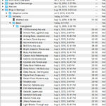 An iPhone connected to a computer, illustrating the process of iTunes/Finder backup and restore.
