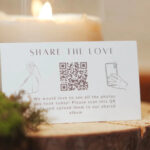 Wedibox QR code on a mini card for easy wedding photo uploads from guest devices.