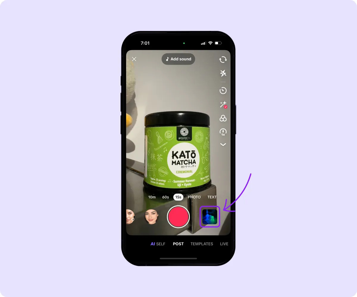 A smartphone displays TikTok’s upload button, ready to access the media library.