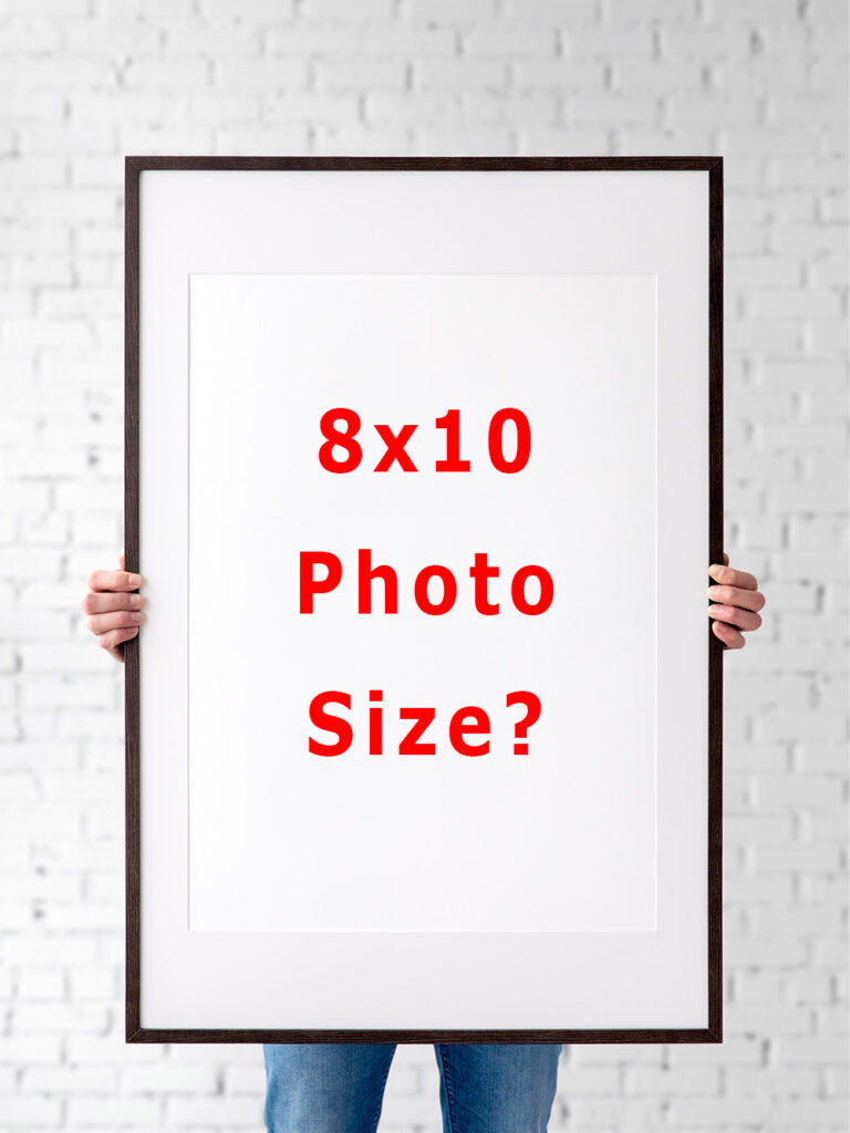 An 8x10 photo next to a ruler showcasing its dimensions