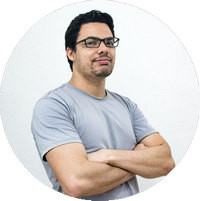 Professional photographer using tethering and backup systems in a studio setting
