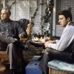 Marlon Brando as Don Corleone with cat in The Godfather, showcasing his iconic role and profound impact