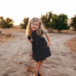 Capturing Personality: A young girl with a genuine princess smile, showcasing her personality in an unforgettable photograph