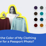 Woman wearing dark blue shirt for passport photo, against a light gray background