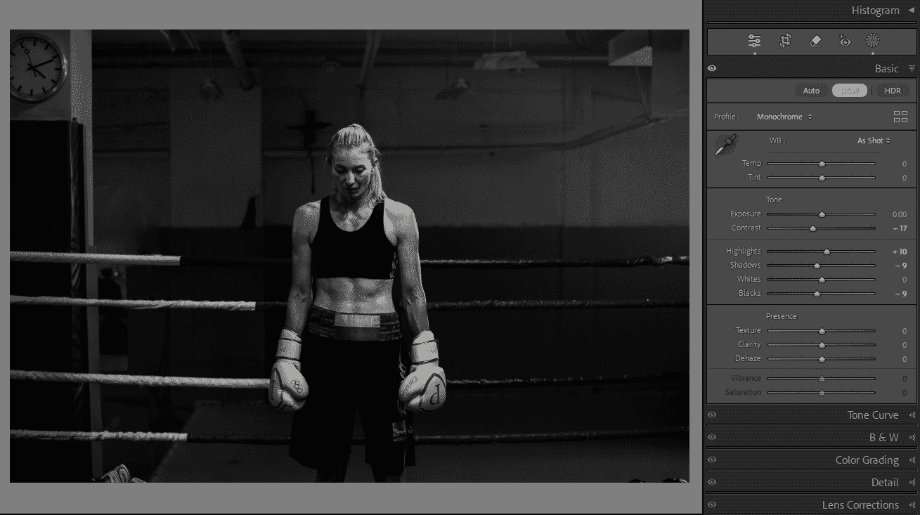 Black and white image of a female boxer in the ring, edited in Adobe Lightroom with monochrome settings and adjustments.