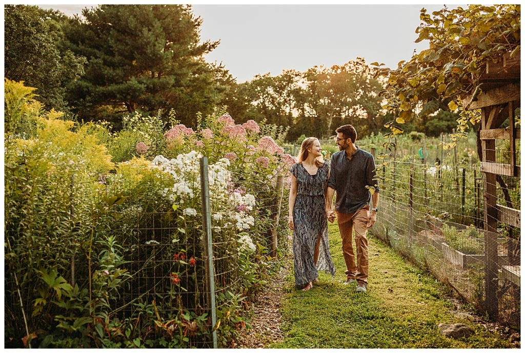 Man and Woman Stroll Hand in Hand Through Belmont Gardens