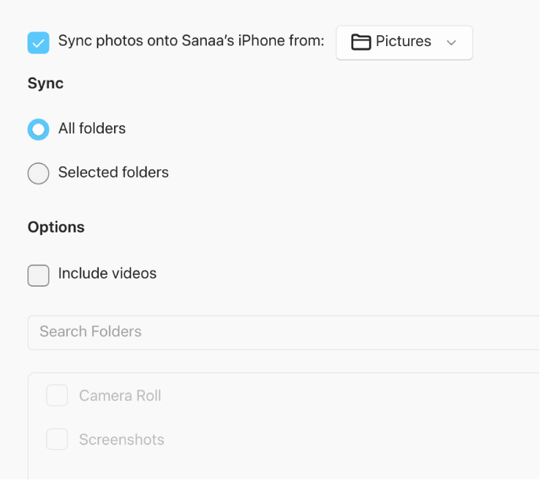 iCloud settings panel in Windows showing photo syncing options.