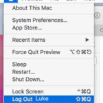 Mac login window showing a blurry desktop background