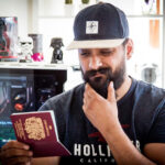 Man with a well-groomed beard for his passport photo, ensuring a clear representation of his current appearance.