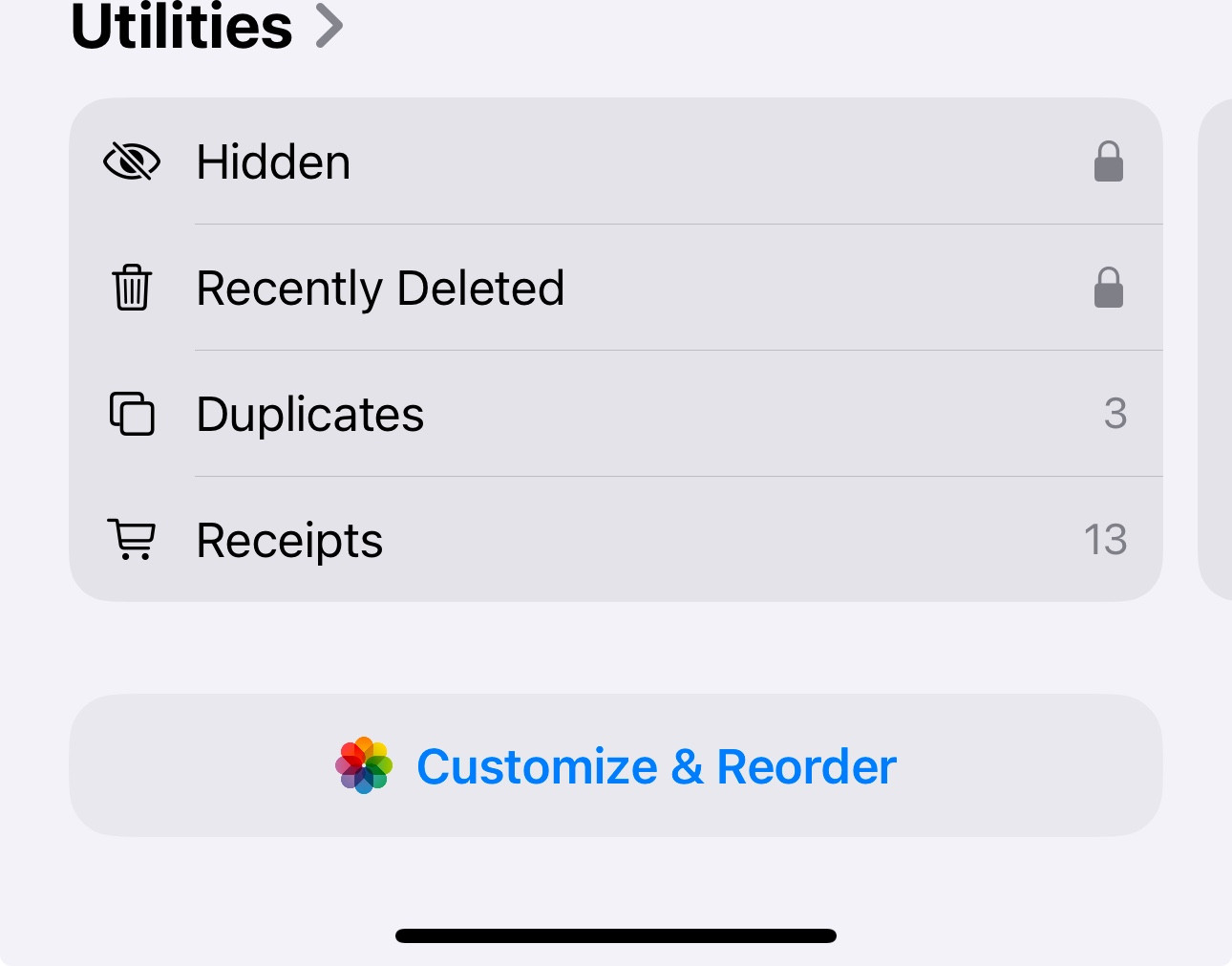 iPhone Photos app showing the location of the Hidden album in the Utilities section