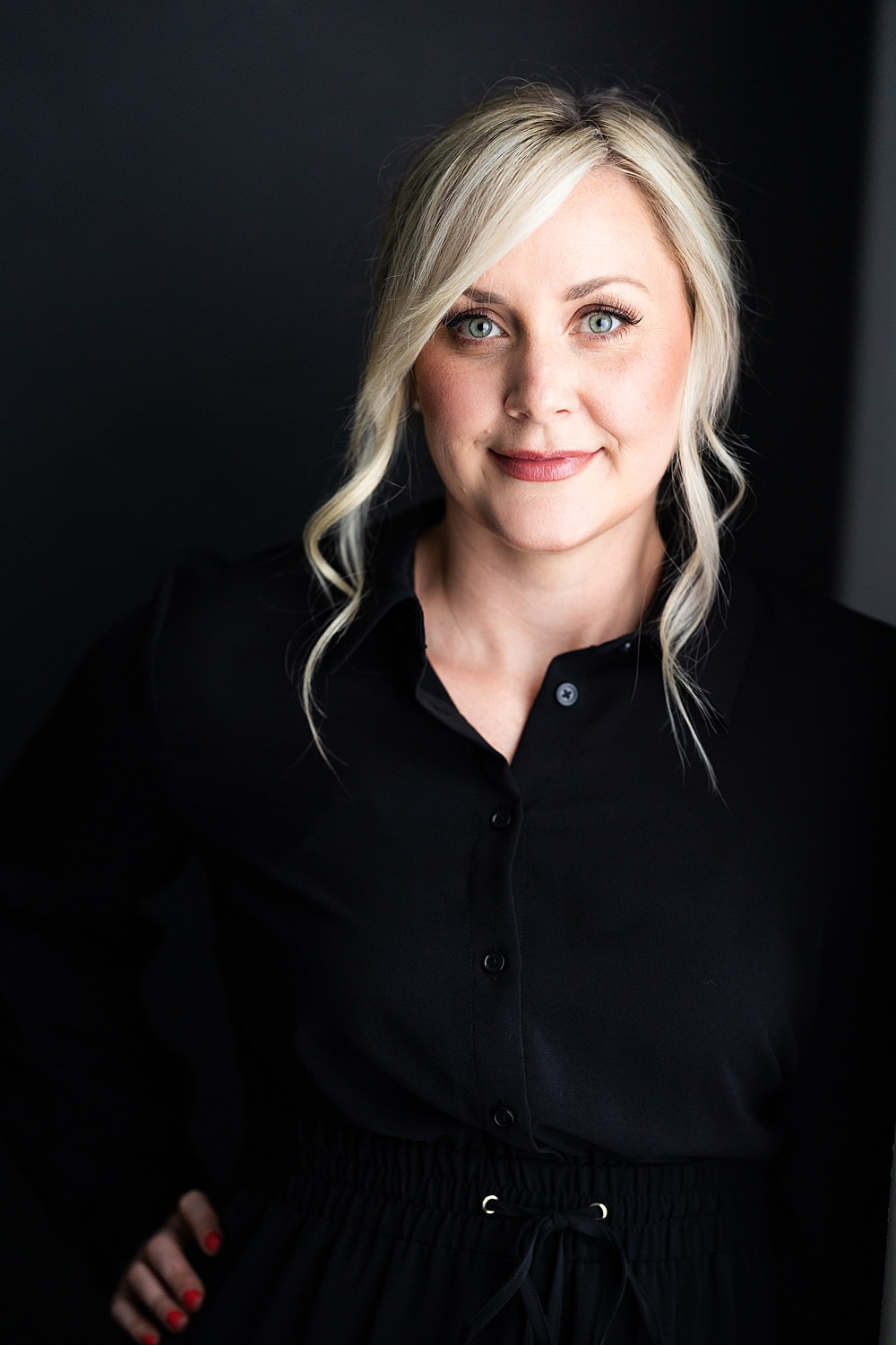 Professional woman in a white shirt for a classic headshot look.