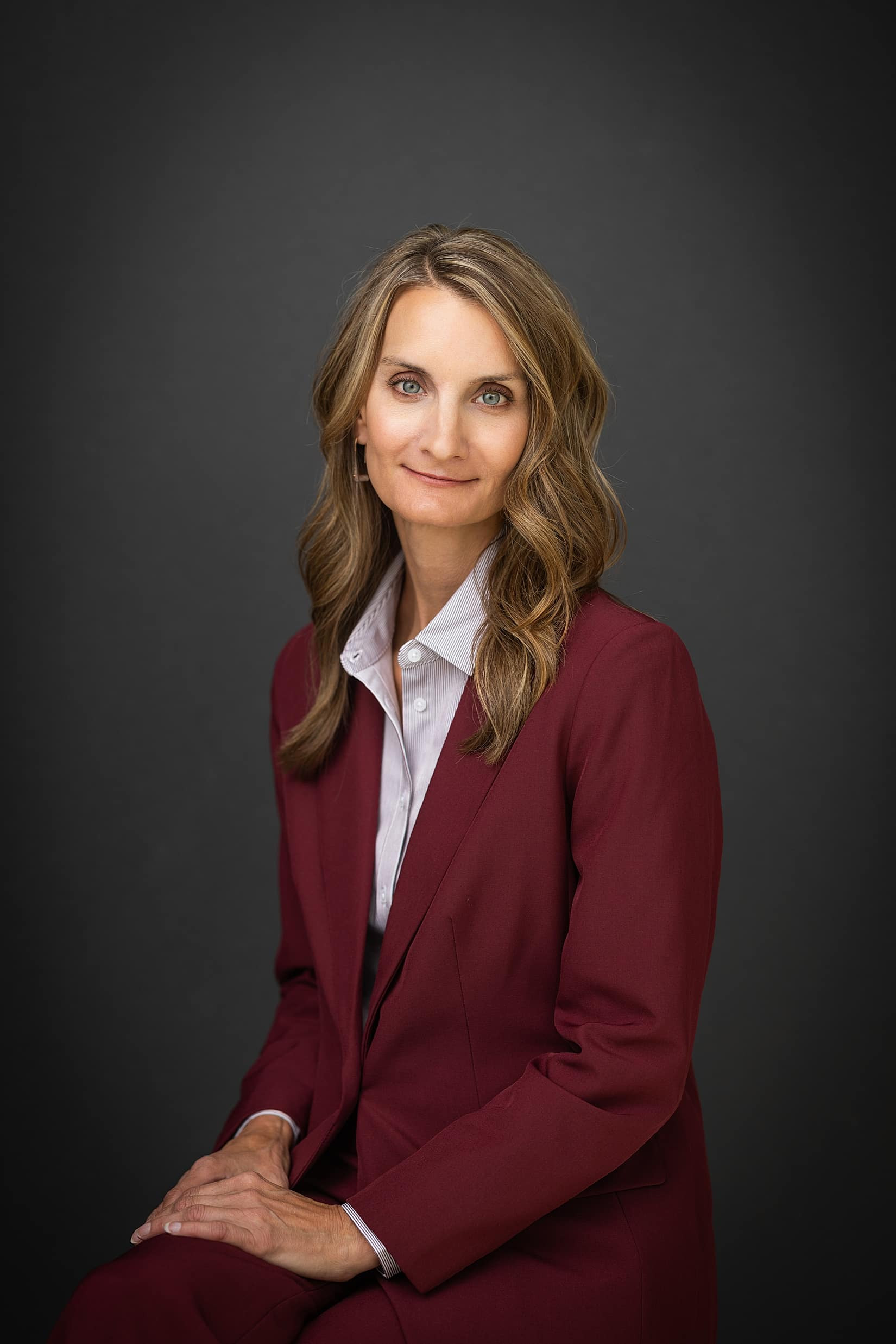 Professional woman wearing a flattering V-neck top.