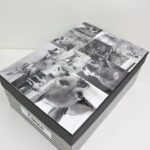 Black and white photo collage on a photo box lid