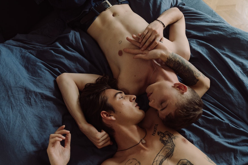 Couple Posing together on a bed