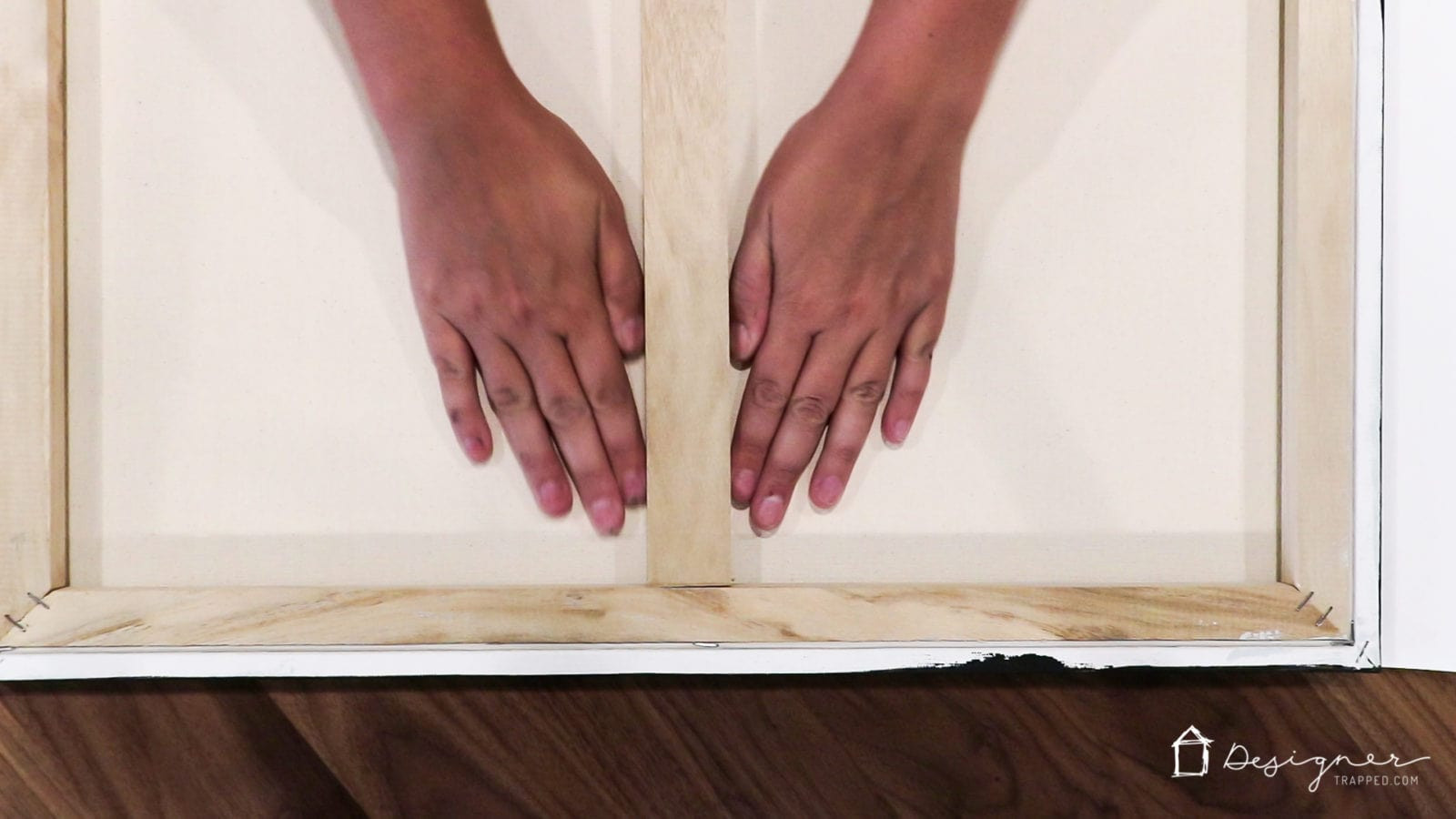 Applying the photo to the Mod Podge-coated canvas