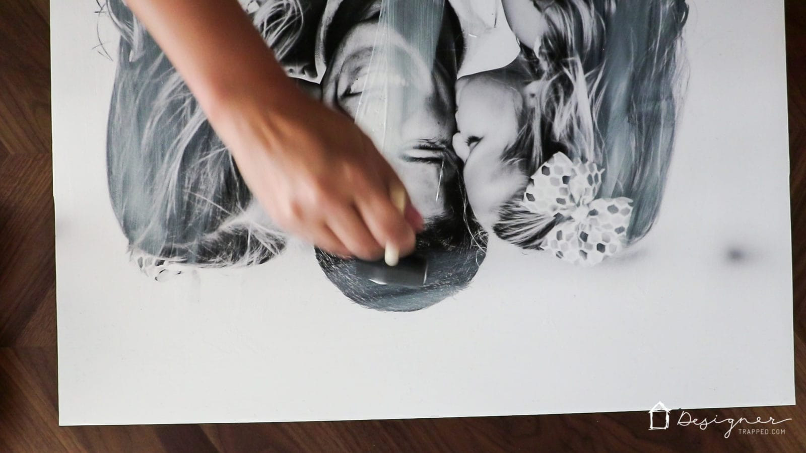 Applying a thin layer of Mod Podge on the photo