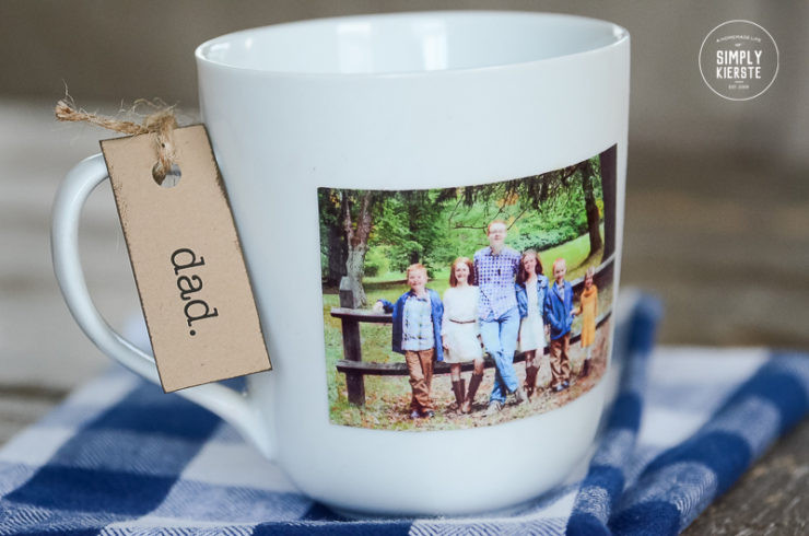 Close-up of a DIY Photo Mug showing clear nail polish being applied over the printed photo for protection