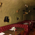 Cave Room's distinctive faux mud-caked walls and man-made stalactites