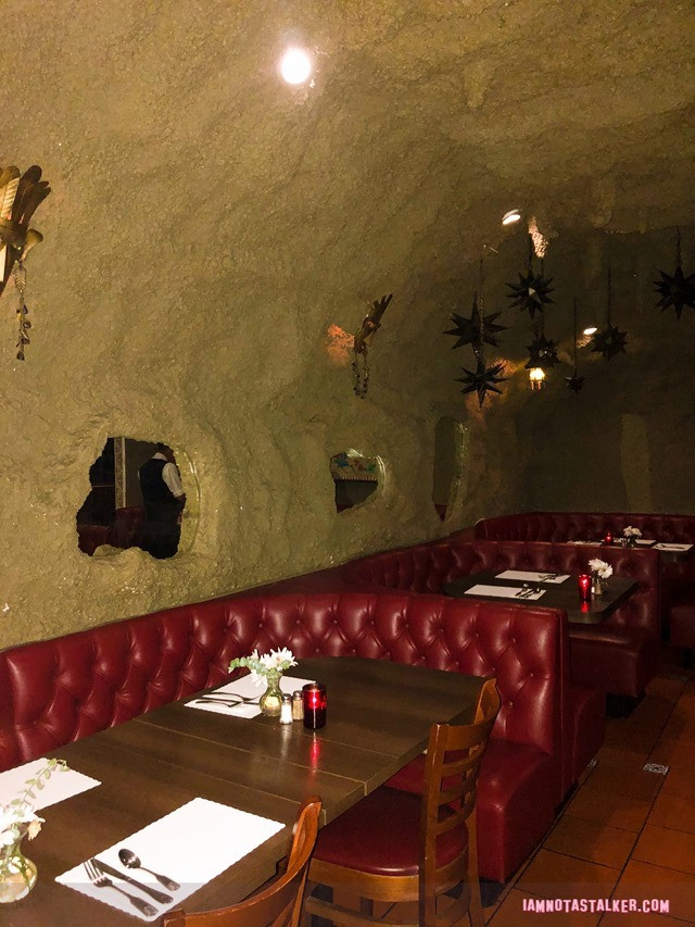Cave Room's distinctive faux mud-caked walls and man-made stalactites