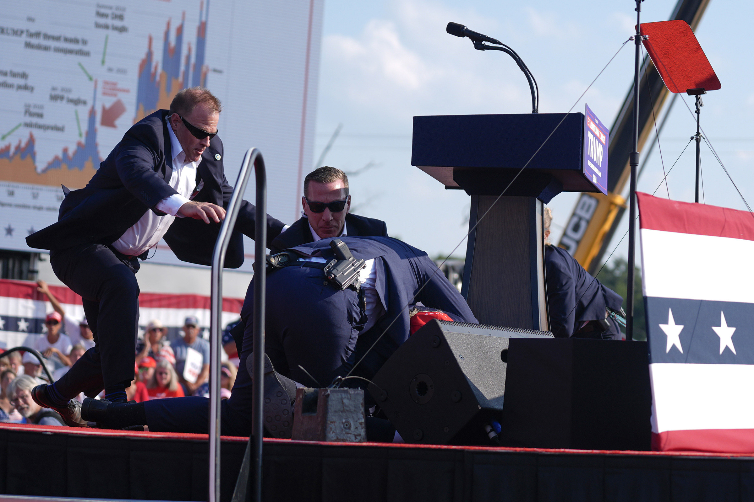 U.S. Secret Service agents converge to cover Republican presidential candidate former President Donald Trump at a campaign rally, July 13.