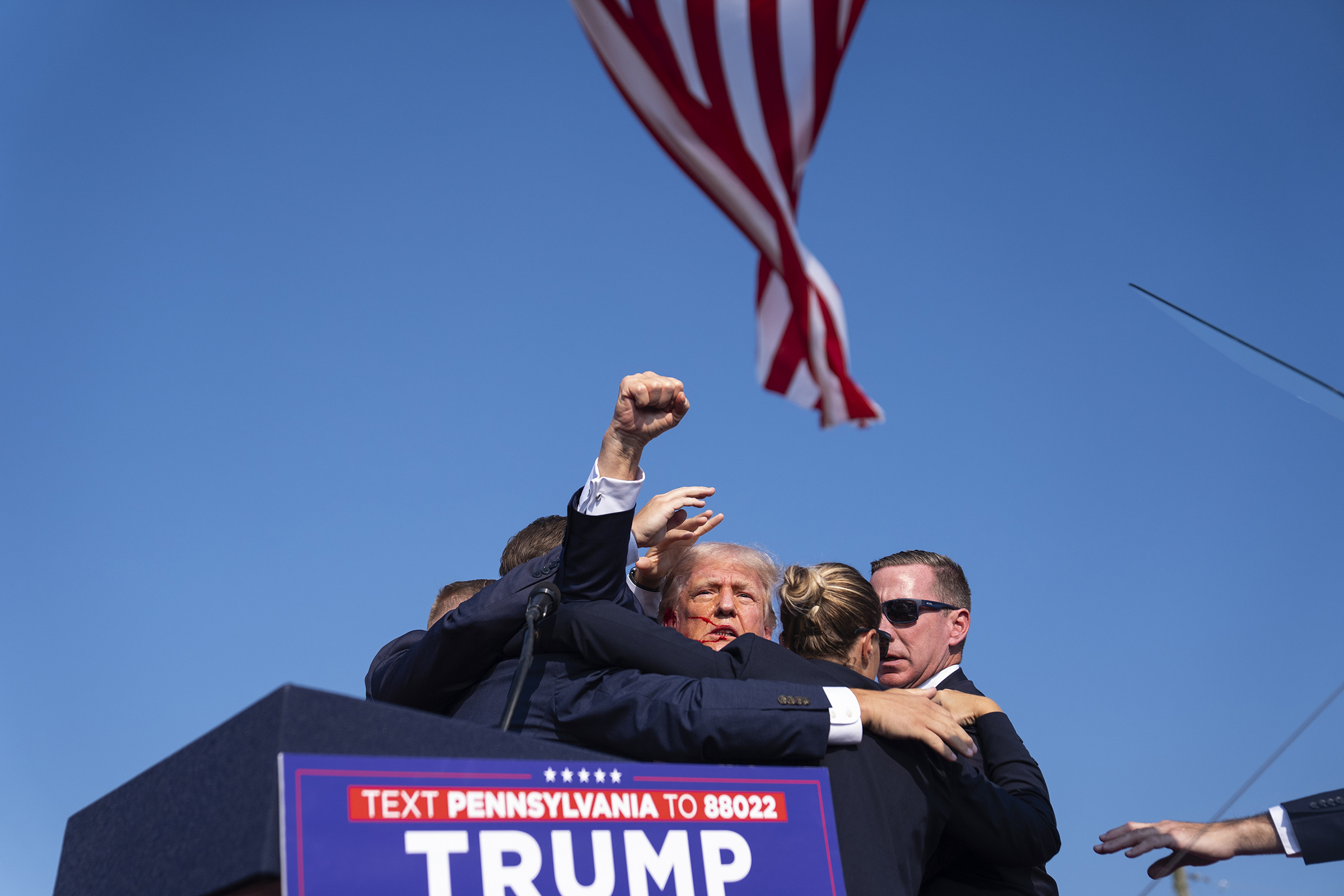 Republican presidential candidate former President Donald Trump is surrounded by U.S. Secret Service agents.