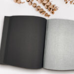 Dry Mount Photo Album with blank pages and acid-free paper, showcasing the flexibility and archival quality of the album.