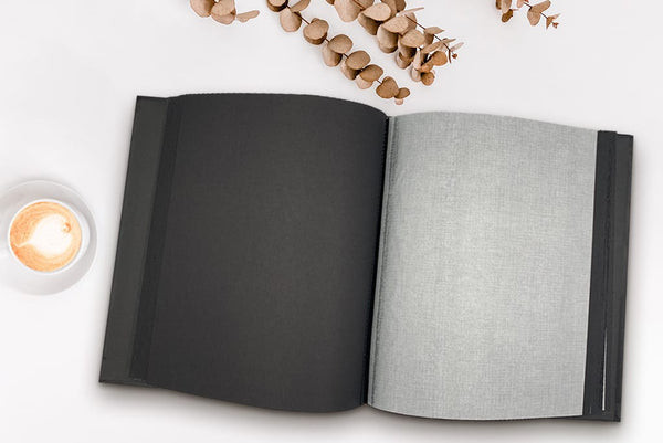 Dry Mount Photo Album with blank pages and acid-free paper, showcasing the flexibility and archival quality of the album.