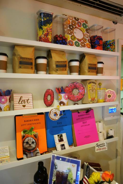 A customer's view of the display case at A Baker's Wife's Pastry Shop, filled with delicious baked goods