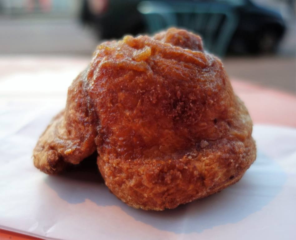 A good morning bun from A Baker's Wife's Pastry Shop, highlighting its layers and sugary glaze