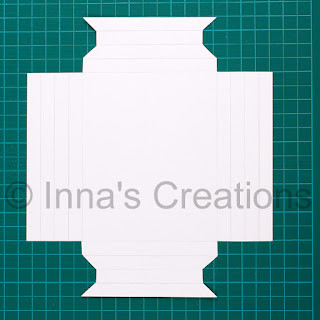 Carefully securing a photo in a handmade paper frame