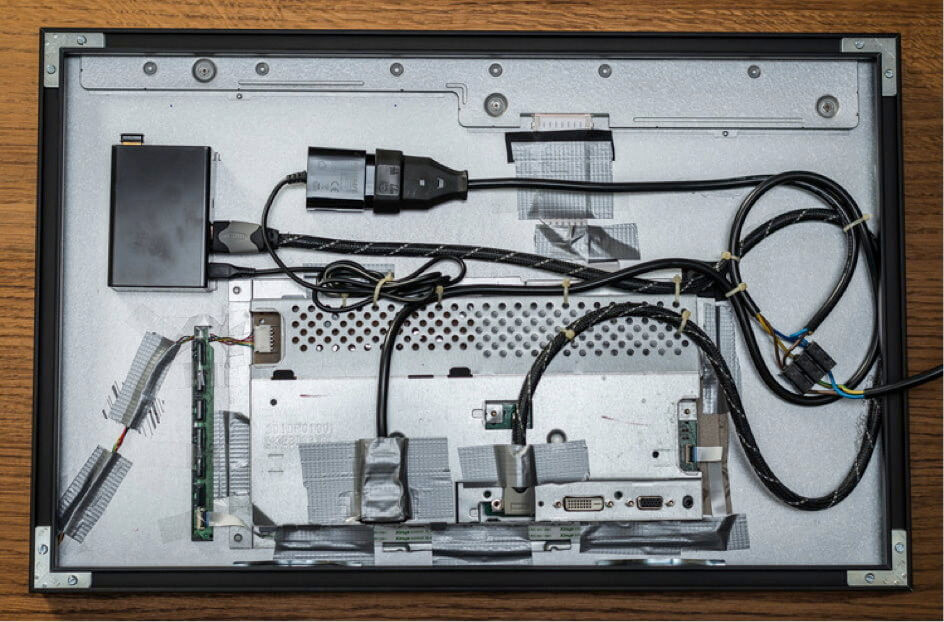 Rear view of a DIY digital photo frame with neatly arranged cables and components, demonstrating effective cable management
