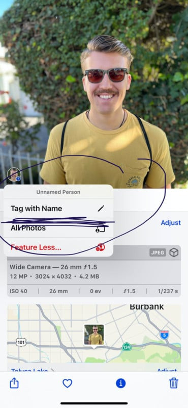 A screenshot highlighting the iPhone Camera app interface, specifically focusing on the info button situated beneath a photo and the circle indicating an untagged face, prompting the user to tag the individual.