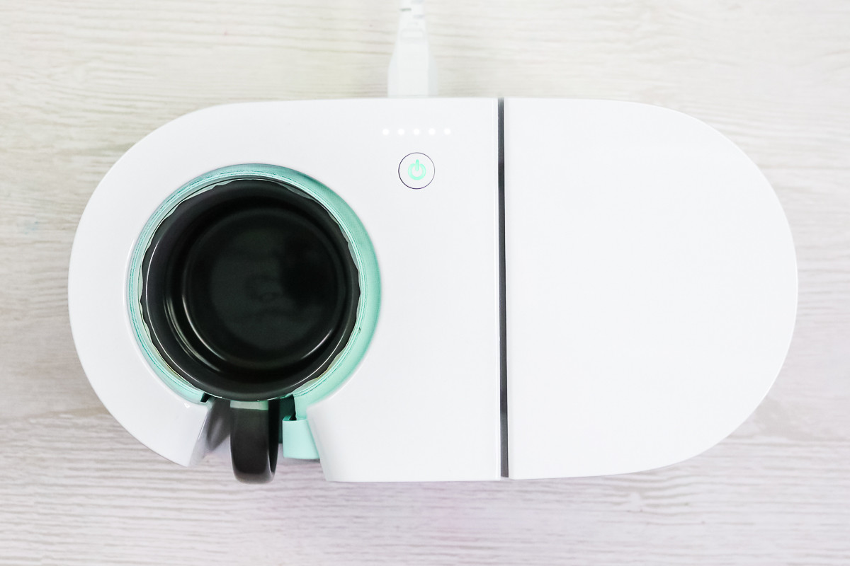 Image of cricut mug press with a photo mug inside