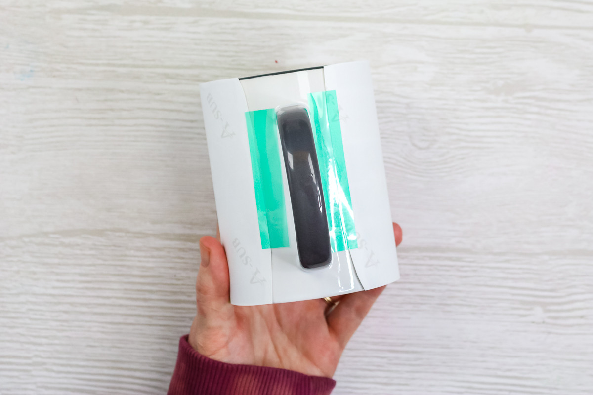 Image of adding tape to a sublimation mug