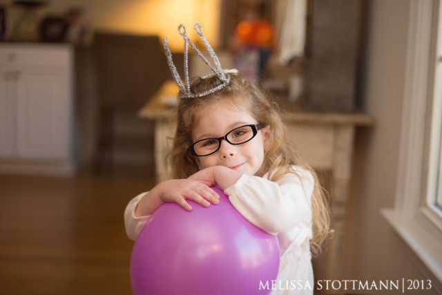 Subject tilting their head away from light to reduce glare in glasses