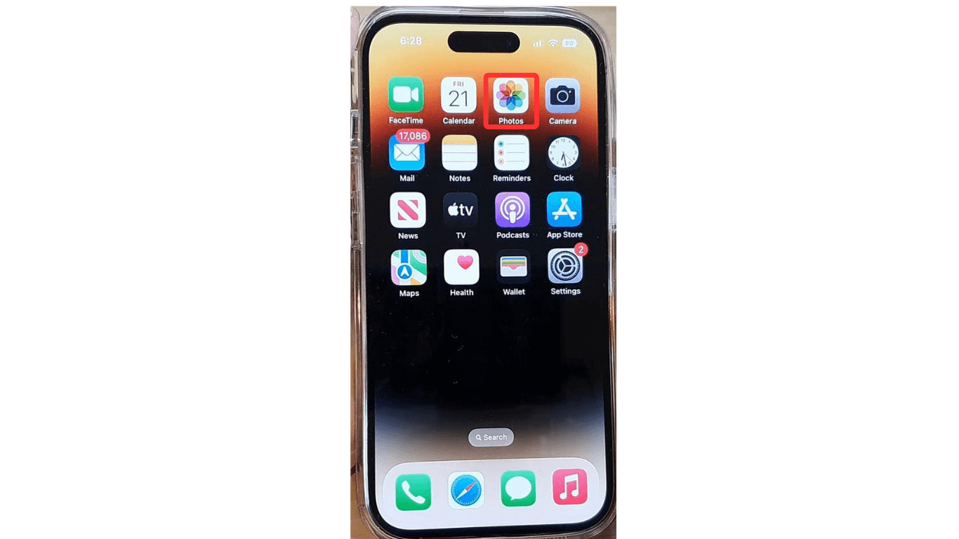 Opening the Photos App on an iPhone to access the media library