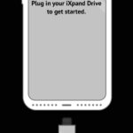 SanDisk iXpand flash drive connected to an iPhone for easy photo transfer