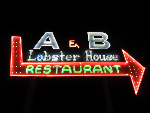 A&B Lobster House neon sign as seen from the Front Street approach, showcasing the iconic branding and inviting atmosphere