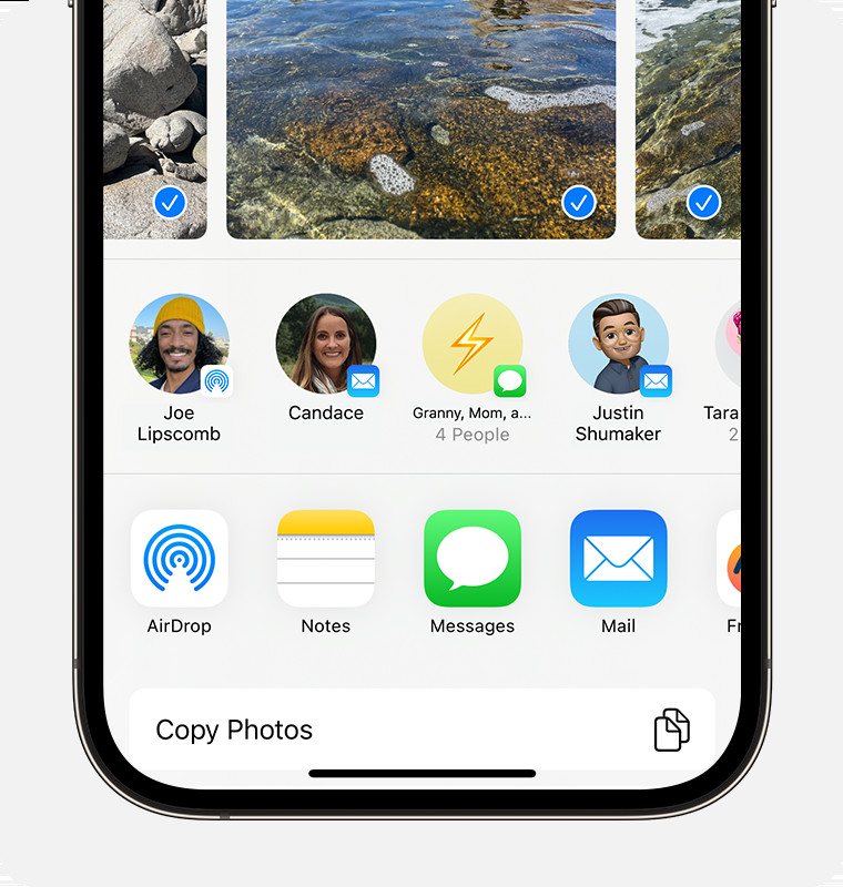 iPhone showing the share sheet with photos selected and the AirDrop option displayed, illustrating how to send photos from iPad to iPhone.