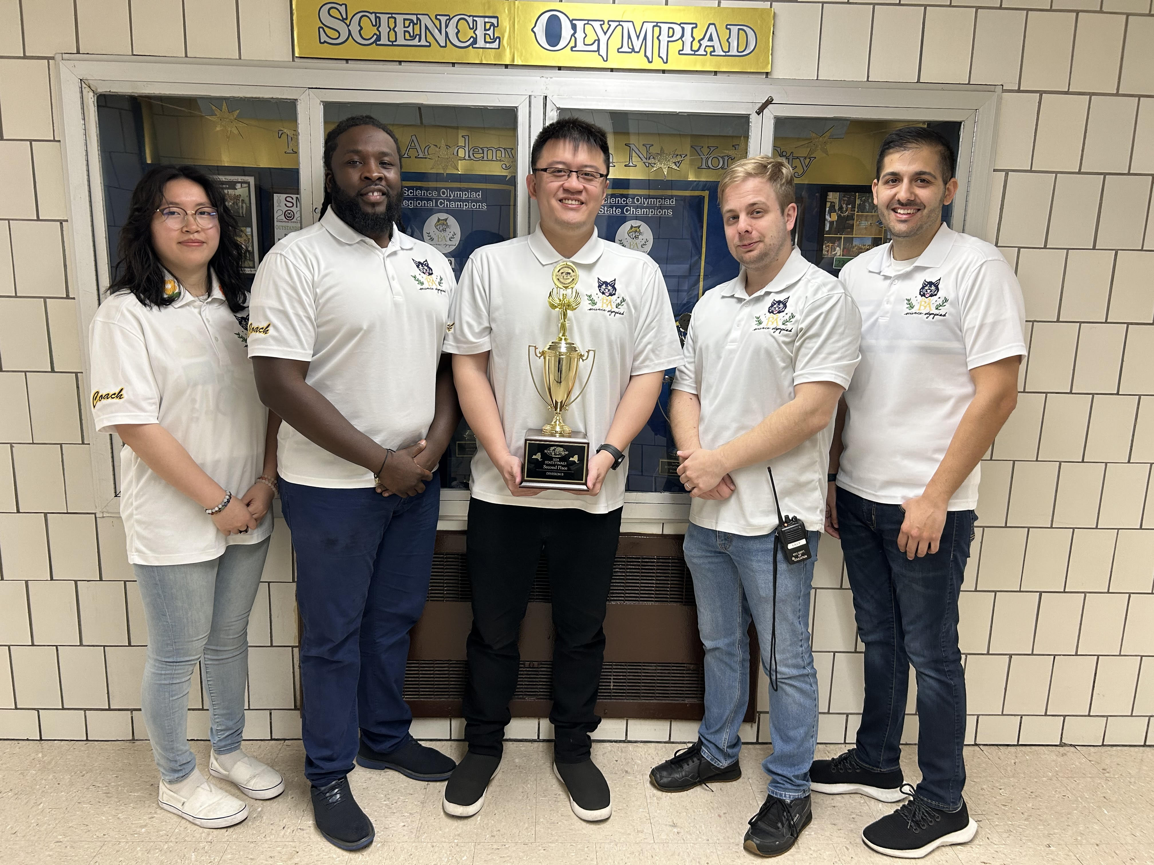 The team’s coaches from I.S. 98, showcasing the supportive environment that fosters scientific achievement