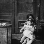 Jacob Riis Photographs Girl Holding Baby