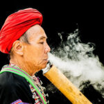 Lahu Smoker displaying photographic storytelling, composition, and capturing cultural moments in his photo portfolio.