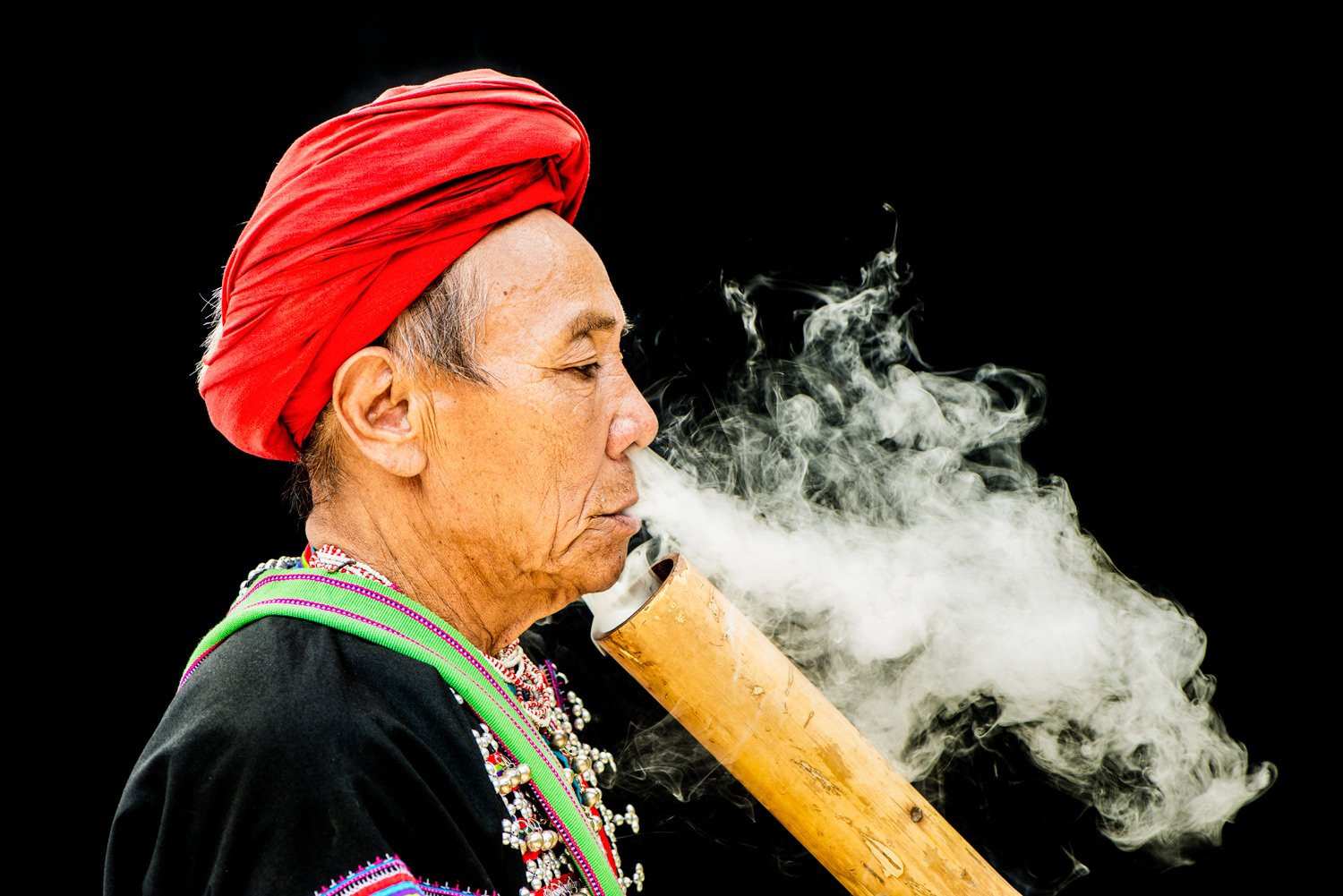Lahu Smoker displaying photographic storytelling, composition, and capturing cultural moments in his photo portfolio.