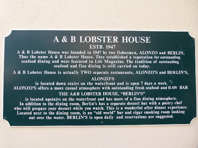 Historical sign outside A&amp;B Lobster House detailing its history, emphasizing the restaurant's iconic branding and historical significance