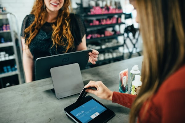 Woman using Adobe Lightroom on a laptop to edit photos for Instagram