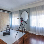 Home studio space for a freelance photographer, showcasing organized equipment and a creative workspace